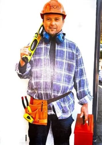A photo from the example memorial: in costume as a builder