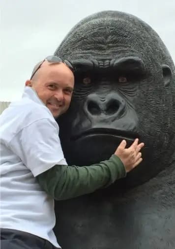 A photo from the example memorial: posing with a statue